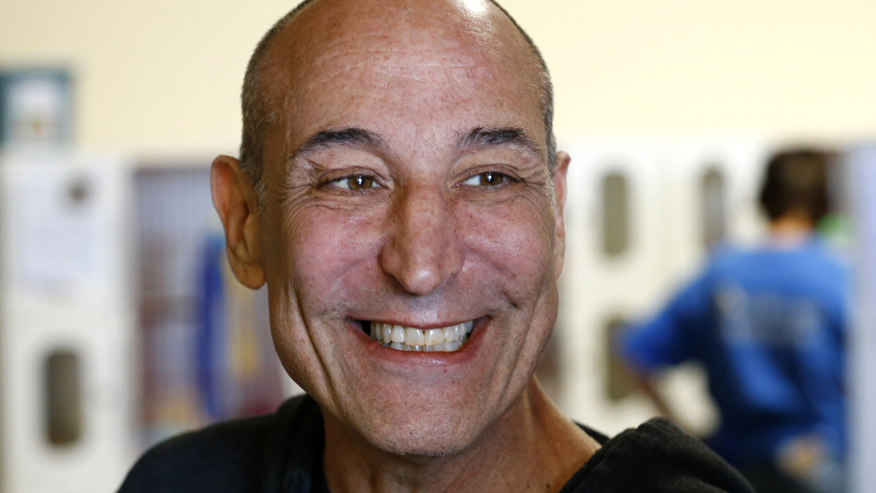 Hollywood mogul and co-creator of The Simpsons, Sam Simon, smiles while visiting the San Diego Humane Society after he financed the purchase of a chinchilla farm in Vista